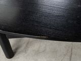 a close up of a black table with a black top