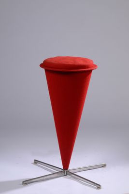 the red stool has a metal base and a red seat