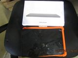 a laptop sitting on top of a chair in a room
