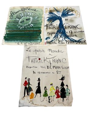 three books are sitting on a table with a drawing on them