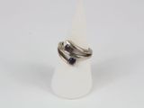 a close up of a silver ring with a blue stone on it