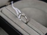 a ring that is sitting in a box on a table