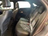 the back seat of a car with a seat belt in the back of it
