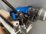 an image of a machine that is working on a piece of paper