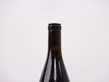 a bottle of wine that is sitting on a table