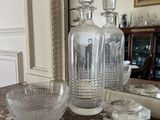 a glass vase and a bowl on a table