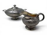 pair of silverplated sugar and creamers on stands