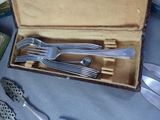 a box that has a set of silverware in it
