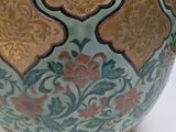 a vase that is sitting on a white table