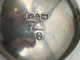 a silver spoon with a number on it sitting on a table