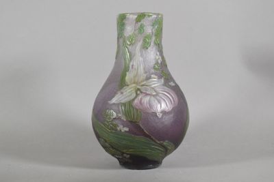 a purple vase with white flowers on it on a white background