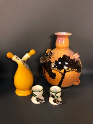 three vases that are next to each other on a table