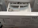 a close up of a dishwasher with the door open