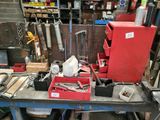 a workbench with tools on it in a garage