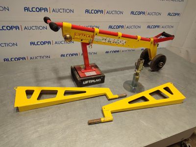a picture of a crane with a red and yellow handle on a table