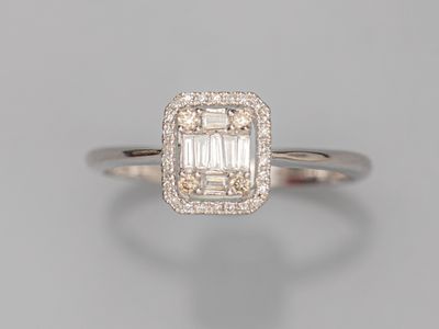 an emerald and diamond ring