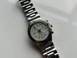 an image of a watch on a table with a white background
