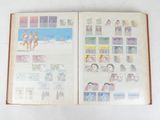 an open book with pictures of people and animals on it