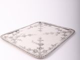 a white tray with a floral design on it