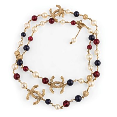 a close up of a necklace on a white background