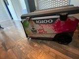 a cooler that is sitting on the floor in the room