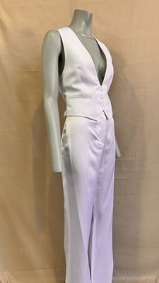 the mannequin is wearing a white dress with a deep v - neck
