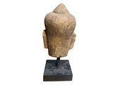 an image of a statue of a head on a stand