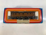 an orange and blue box with a train on it on a white surface