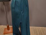 an image of a mannequin wearing a blue and green striped pants