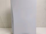 a white paper towel dispenser sitting on a table