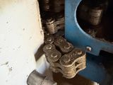 a close up of a machine that has a chain attached to it