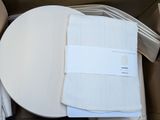 a lot of folded napkins on a table in a box