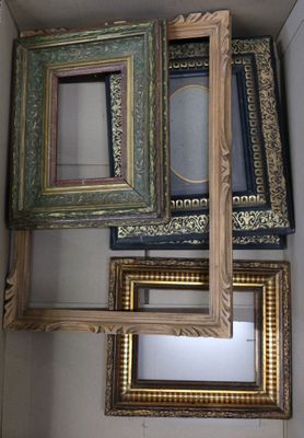 many different colored frames in a box with a mirror