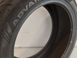 a close up of a tire on a white surface