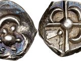 une image représentant une pièce d'argent sur laquelle figure une croix