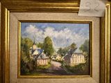 a picture of a painting in a gold frame on the wall