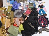 a pile of assorted clothing and accessories on a table