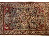 an antique persian rug with a floral design on a white background