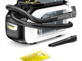 the black and white steam iron is next to a yellow and black pen