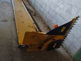 a yellow machine that is sitting on the ground