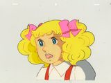 cellule d'animation représentant une fillette aux cheveux blonds avec un nœud rose