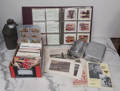 a table with a bunch of books and a bottle on it