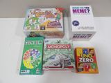several board games are laid out on a white surface