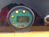 a close up of a digital clock on the side of a vehicle