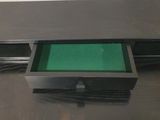 a black table with a green tray on top of it