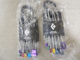 two pairs of gloves that are wrapped in plastic