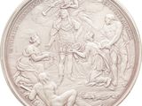 an image of a silver coin with a depiction of a woman and two men