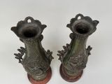 two vases that are sitting on top of each other