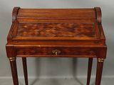 a small wooden table with a drawer on top of it