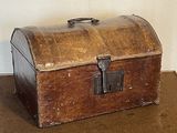 an old wooden trunk sitting on the floor